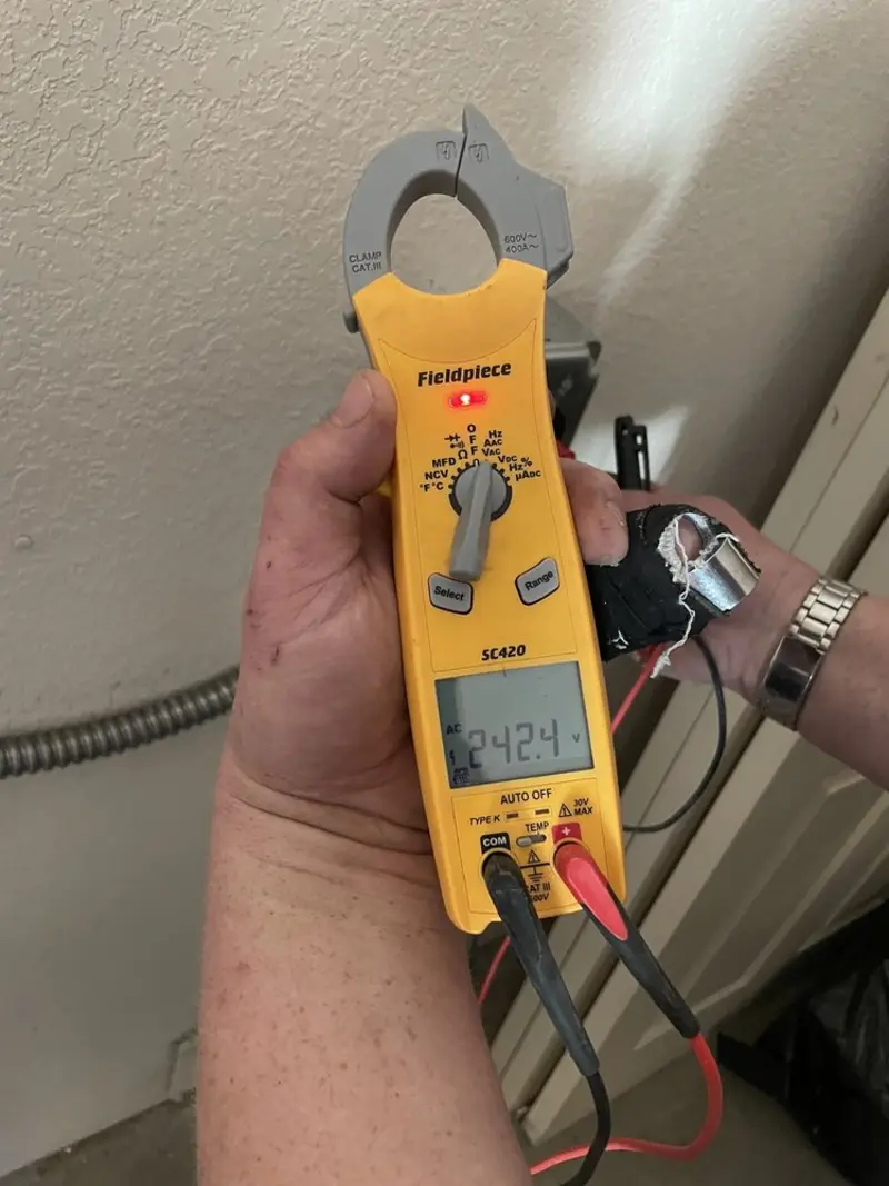 Voltage testing with clamp meter during Recessed Lighting Installation in Wichita